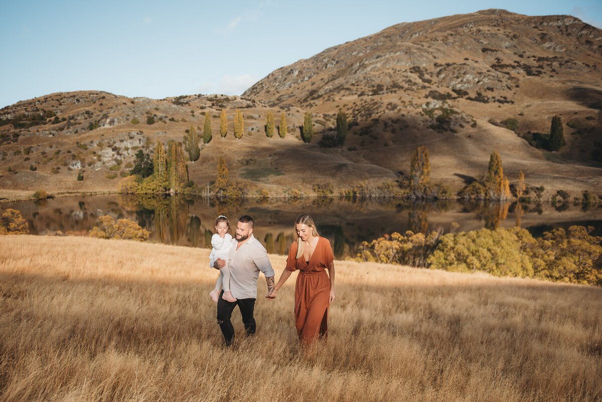 family walking during a Queenstown family photography session at Lake Johnson in Queenstown captured by Bie