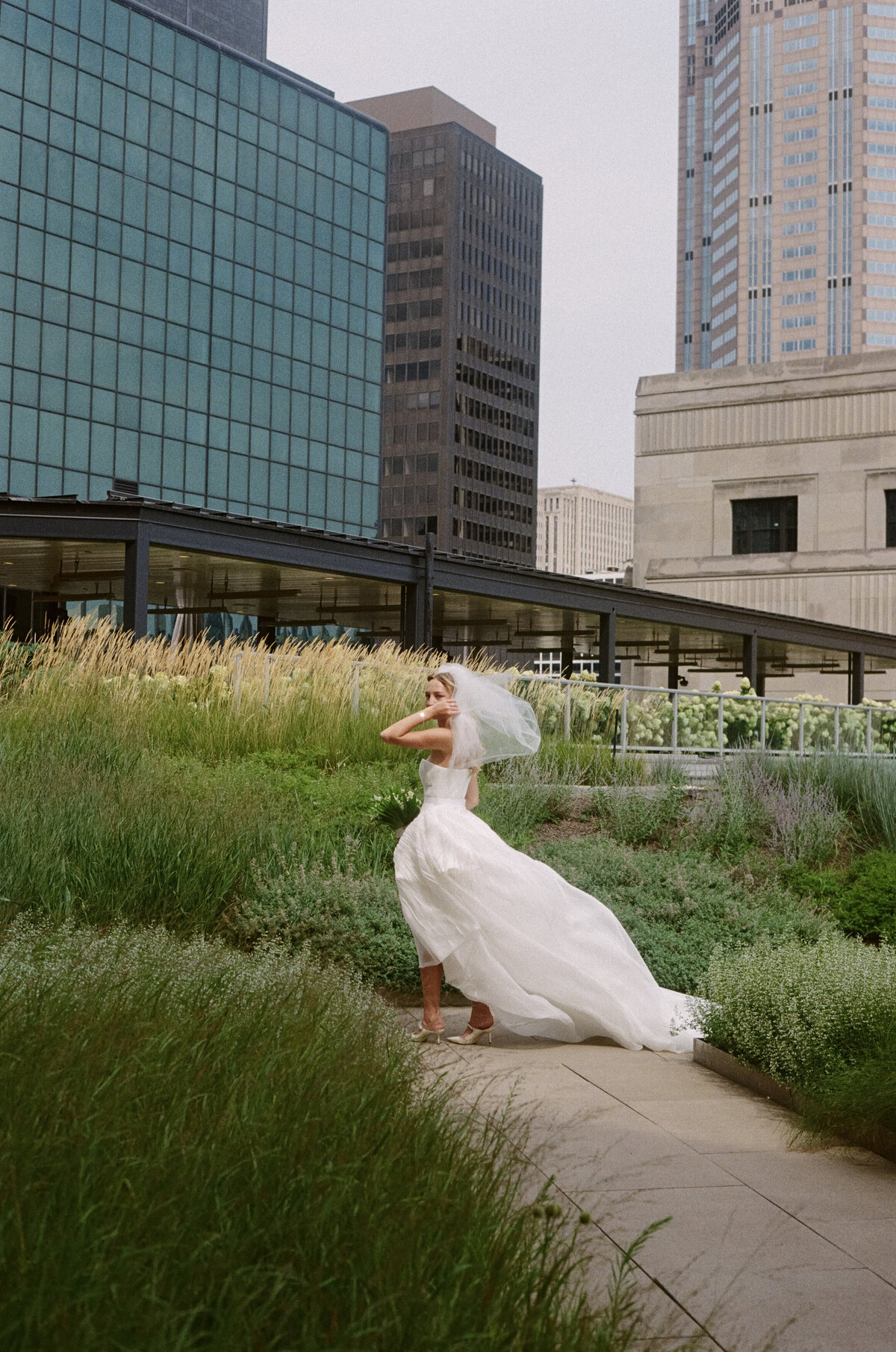 Fashion forward editorial wedding photography captures ceremony elegance at Old Post Office Chicago, showcasing Lauren Alatriste's sophisticated approach combining architectural beauty with magazine-worthy aesthetics and authentic wedding day  emotion.