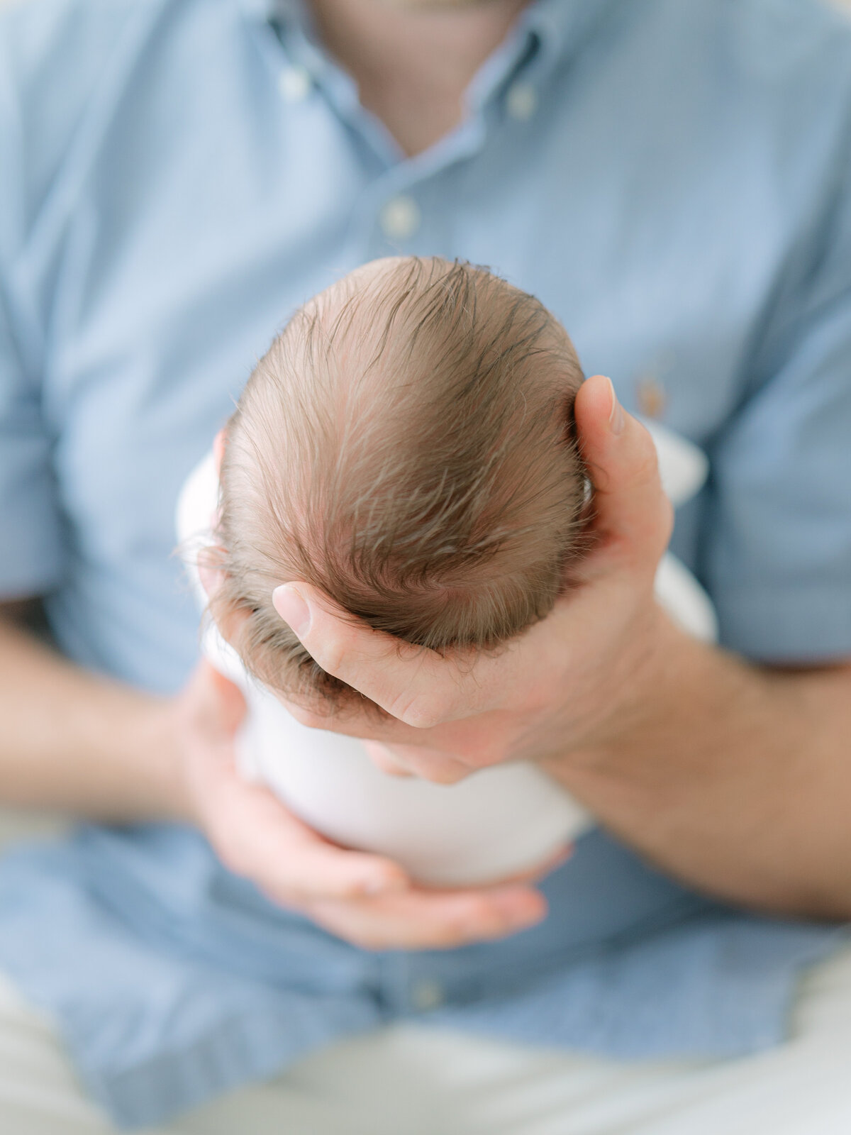 Baby head showcasing hair by apex newborn photographer 