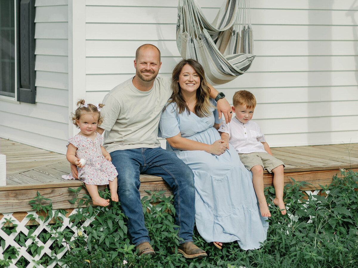 Family sitting on front porch
