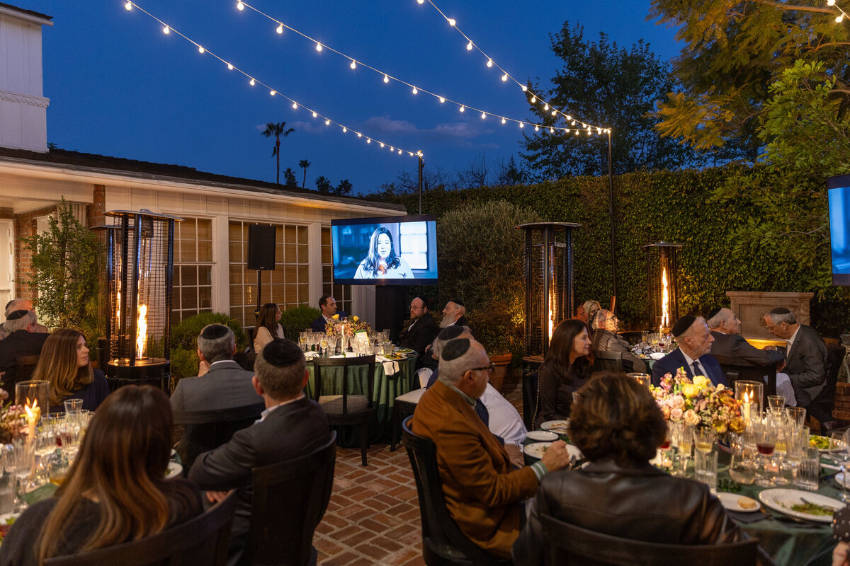 dinner with bistro lights and a presentation