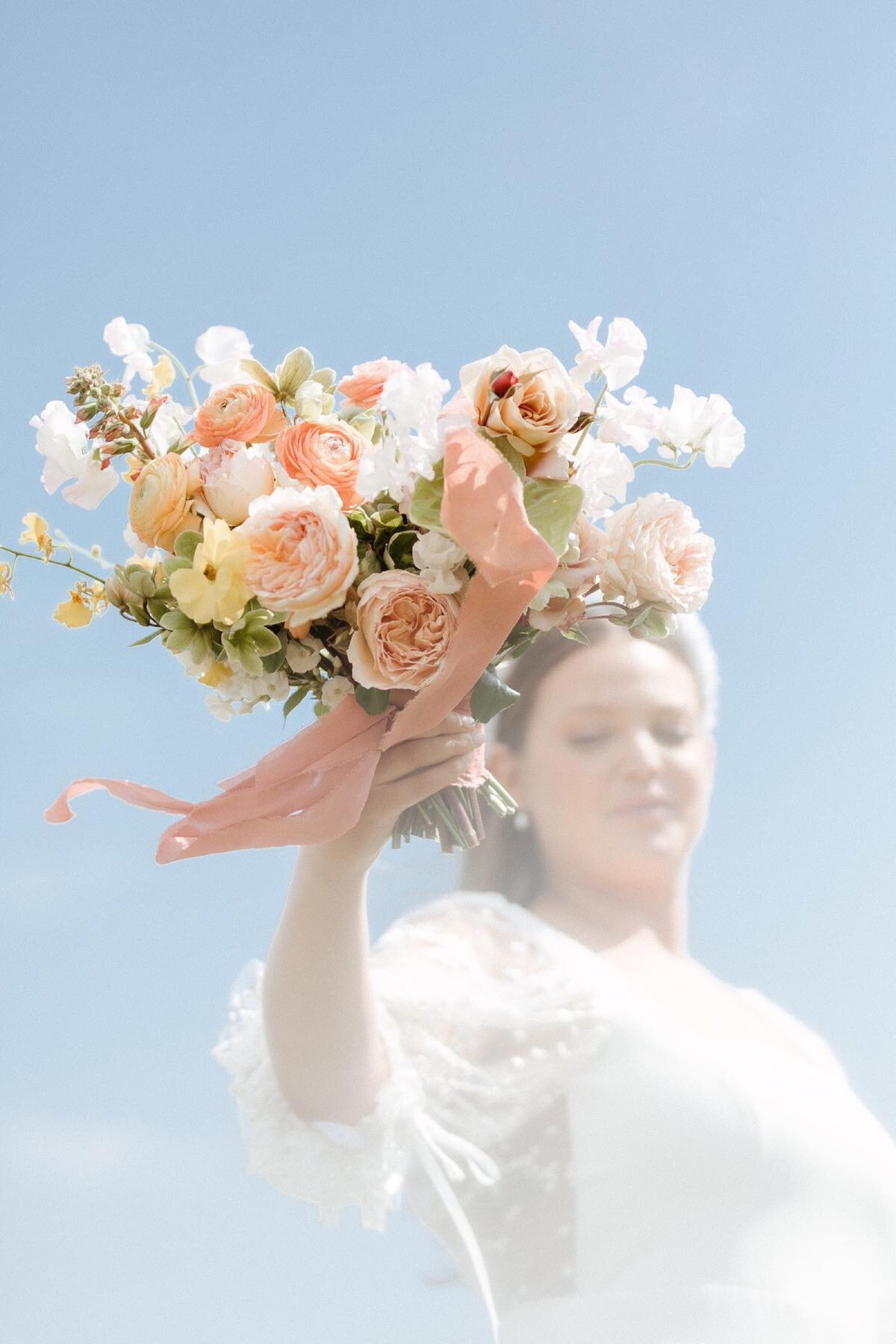 Bridal-Bouquet-Elevated-Against-Blue-Sky