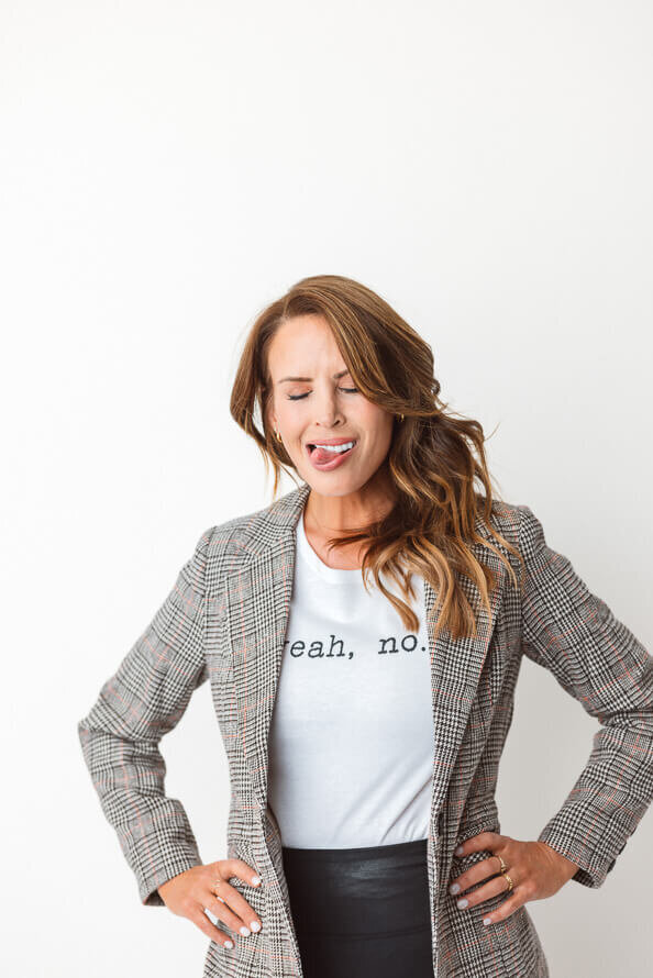 Girl closing her eyes and sticking tongue out for her headshots.