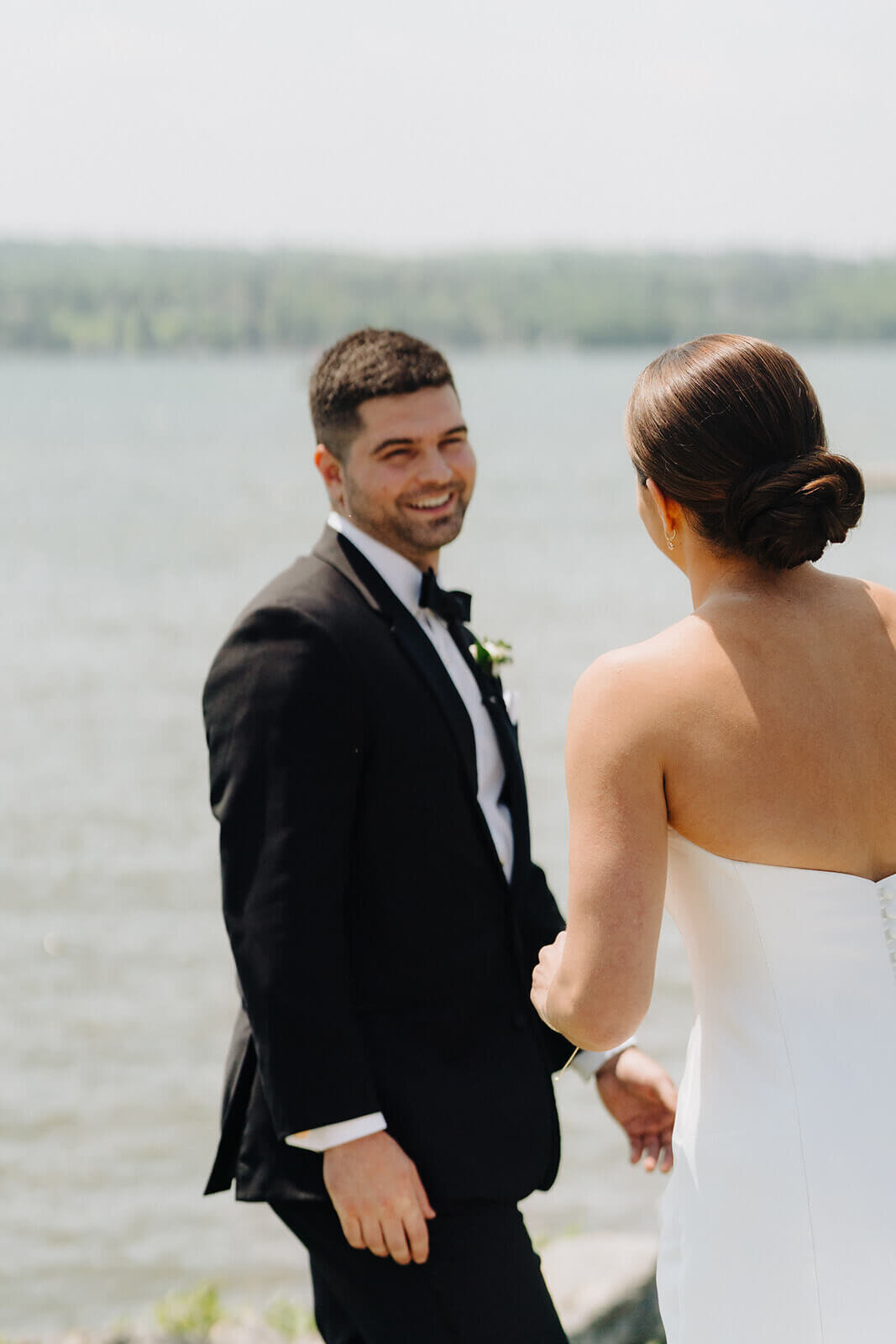 Groom looking at bride at Canandaigua Country Club wedding, NY