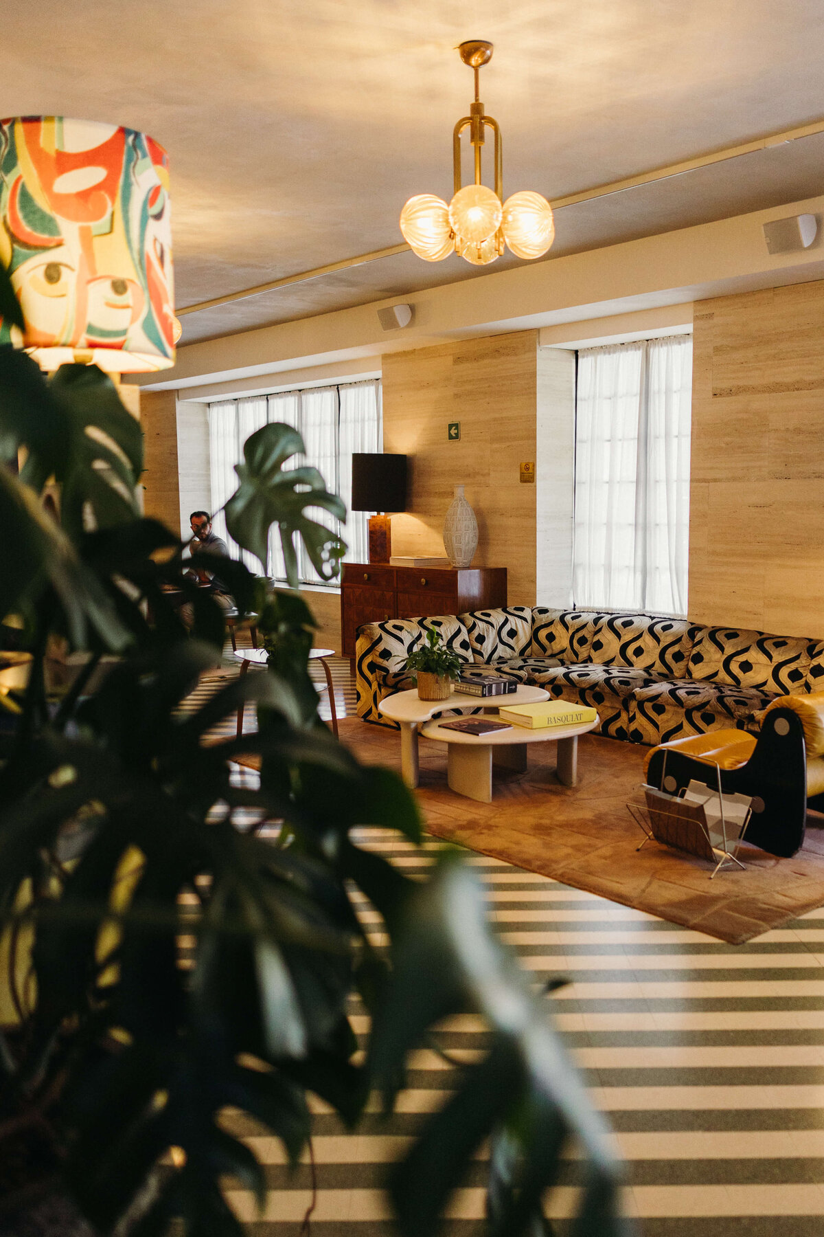 Cozy wedding lounge space with modern art and soft lighting at Soho House Rome