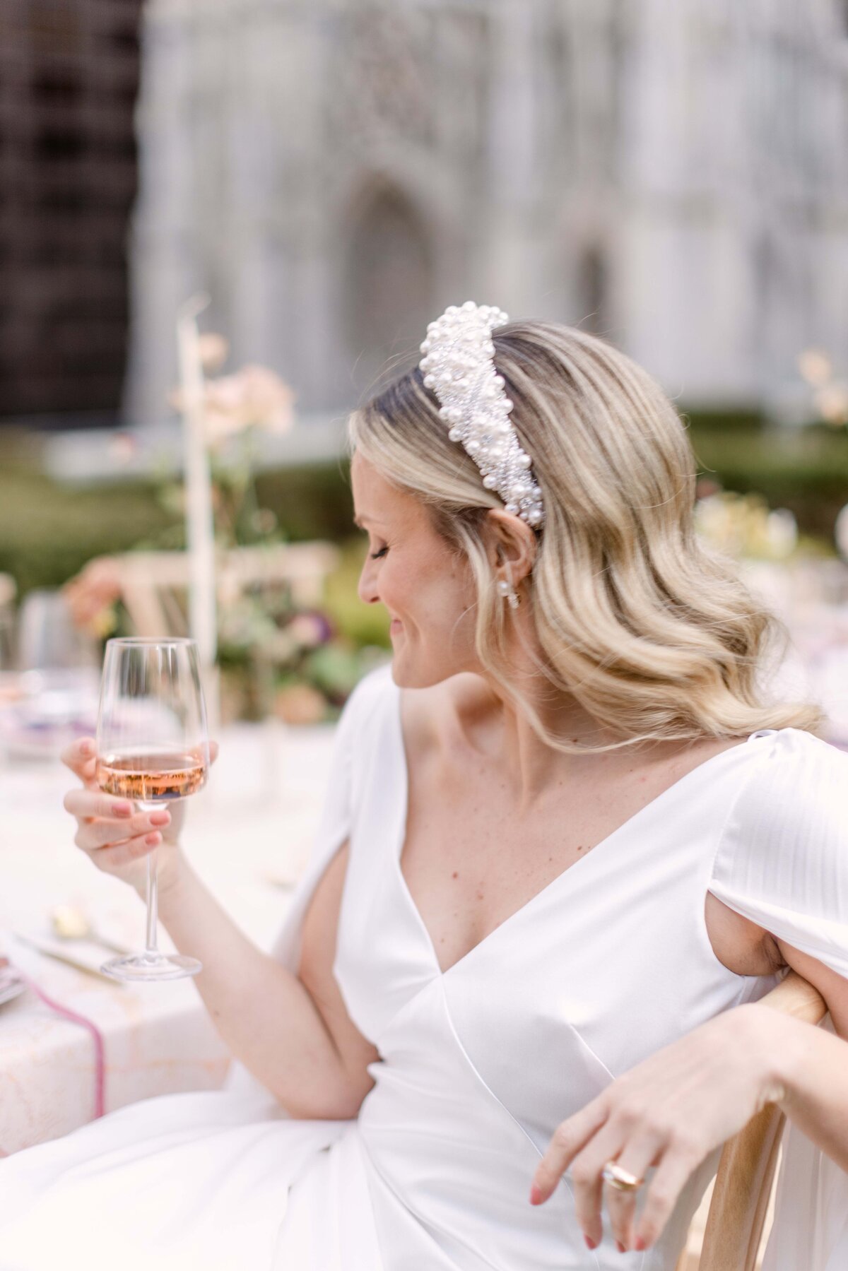 Bride drinking wine at 620 Loft and Gardens in New York