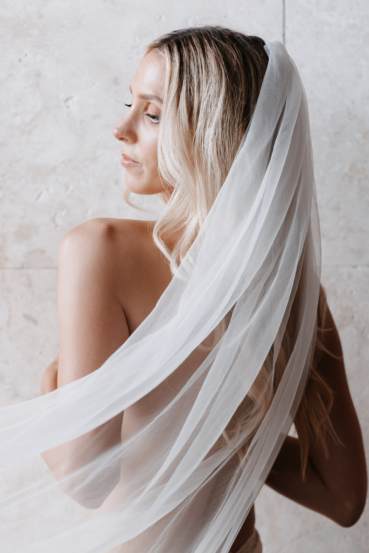 Wedding Photography, bridal boudoir portrait with sweeping veil