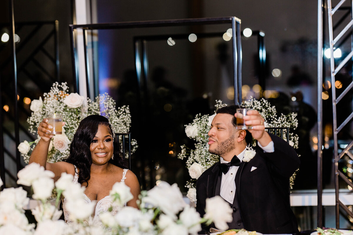 couple toasting at sh table