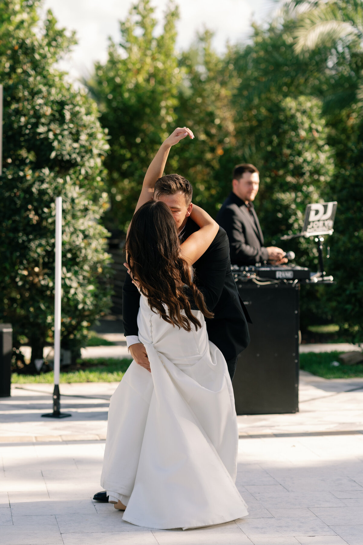 Bride and groom dancing during outdoor reception at La Casa Toscana 