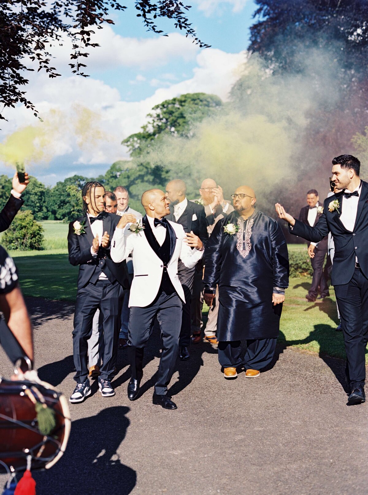 A wedding photo of the groom celebrating with his groomsmen at Luttrellstown Castle in Ireland