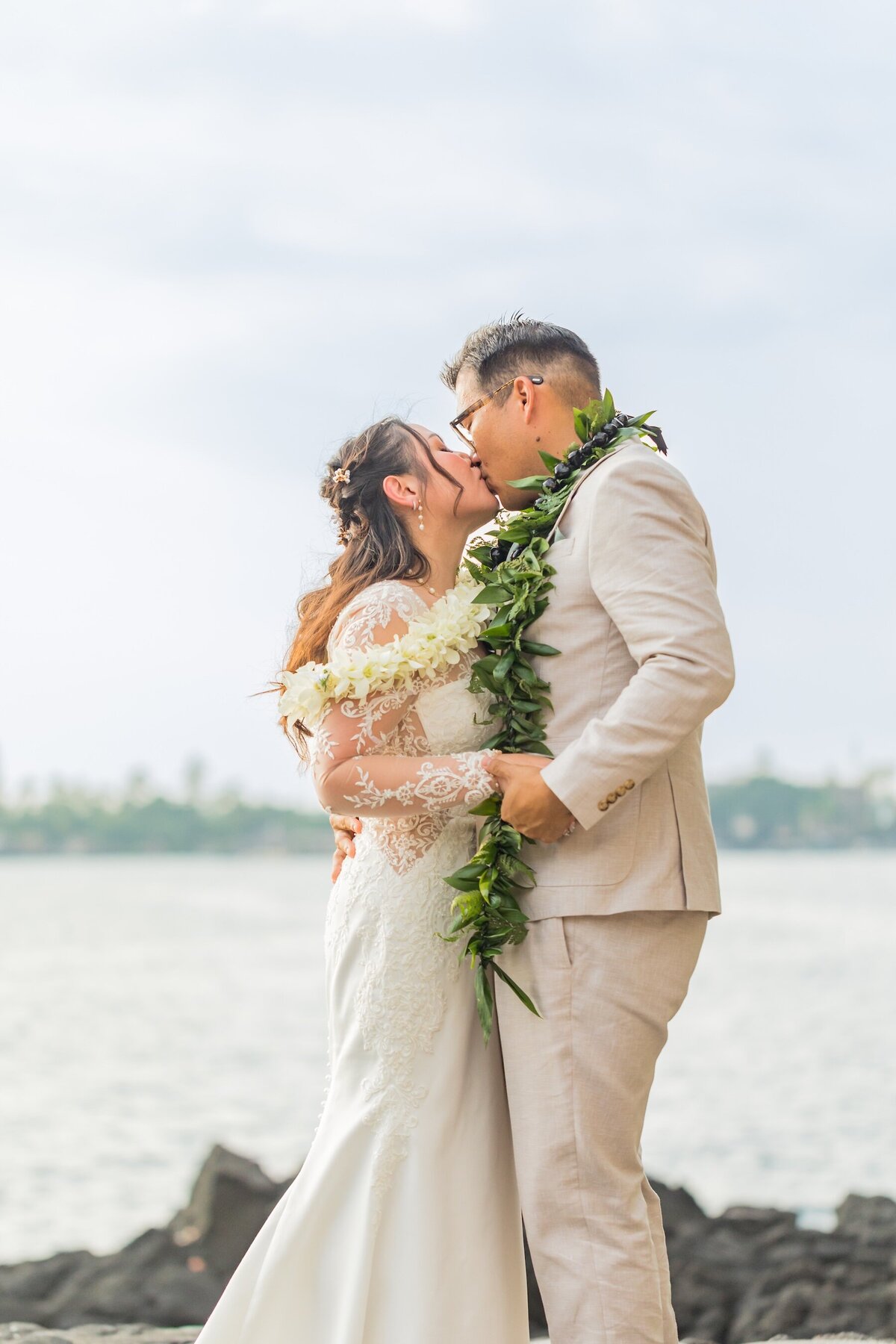 Romantic first kiss by Big Island wedding photographers