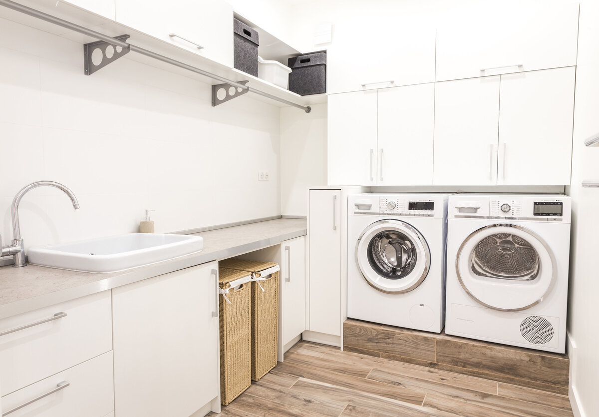 bright home kitchen with refrigerator and viking appliances