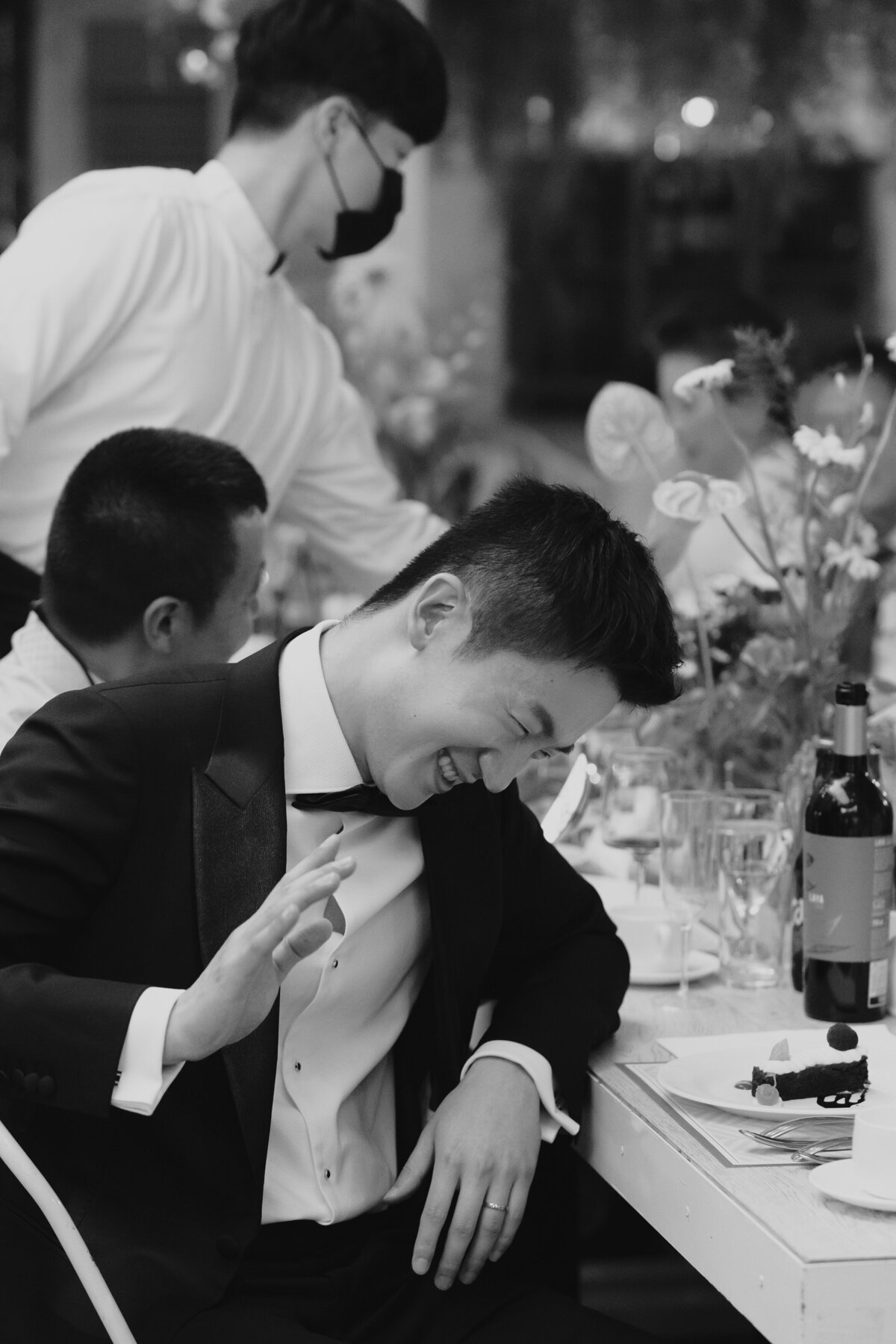groom laughing at the speech