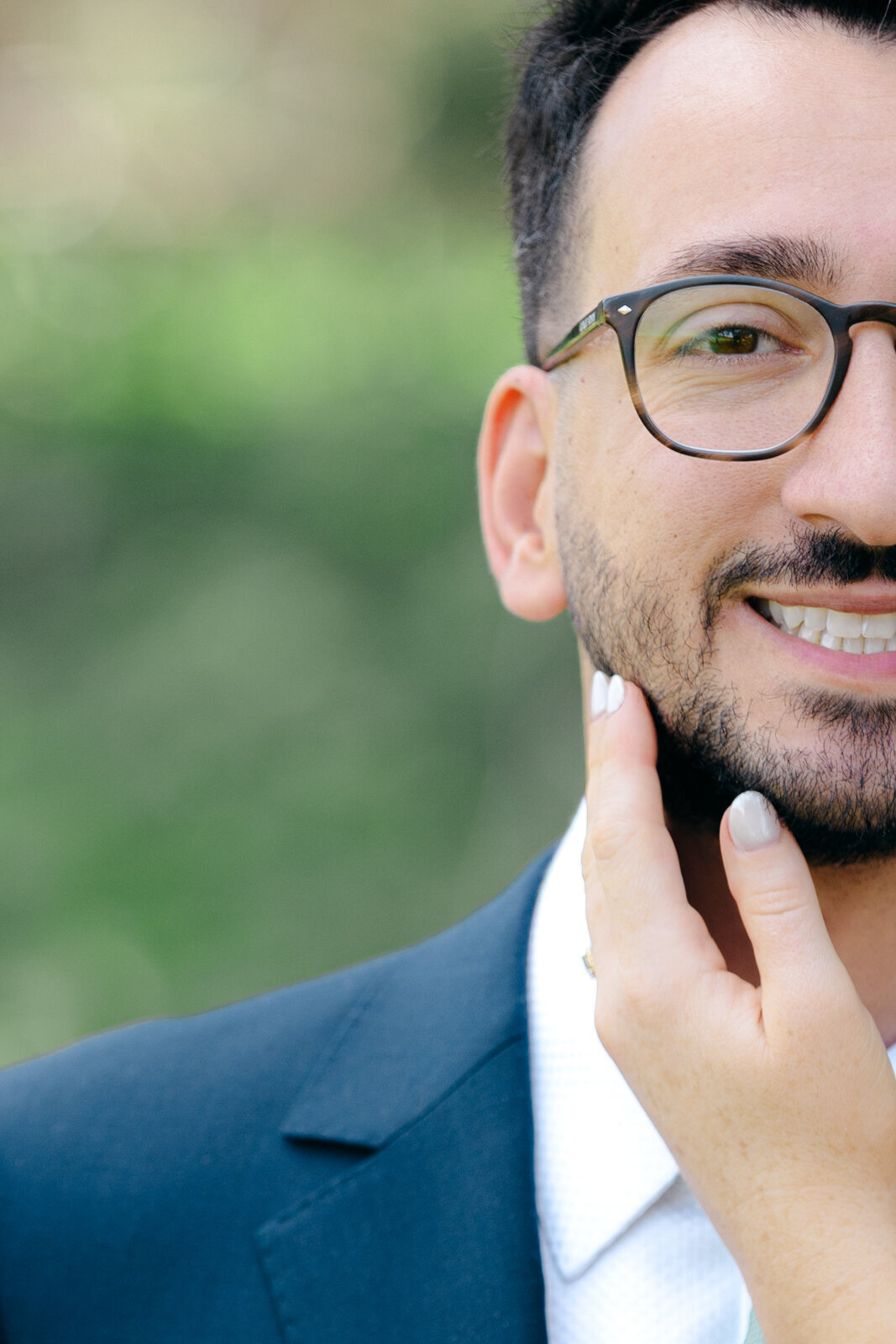Close-up portrait of the groom showing only half of his face