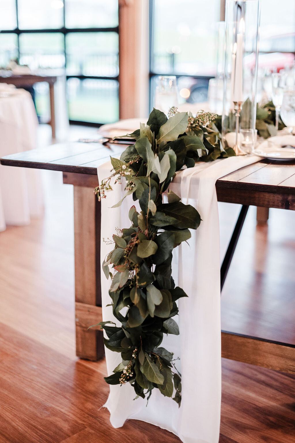 Farm table with sheer runner and garland