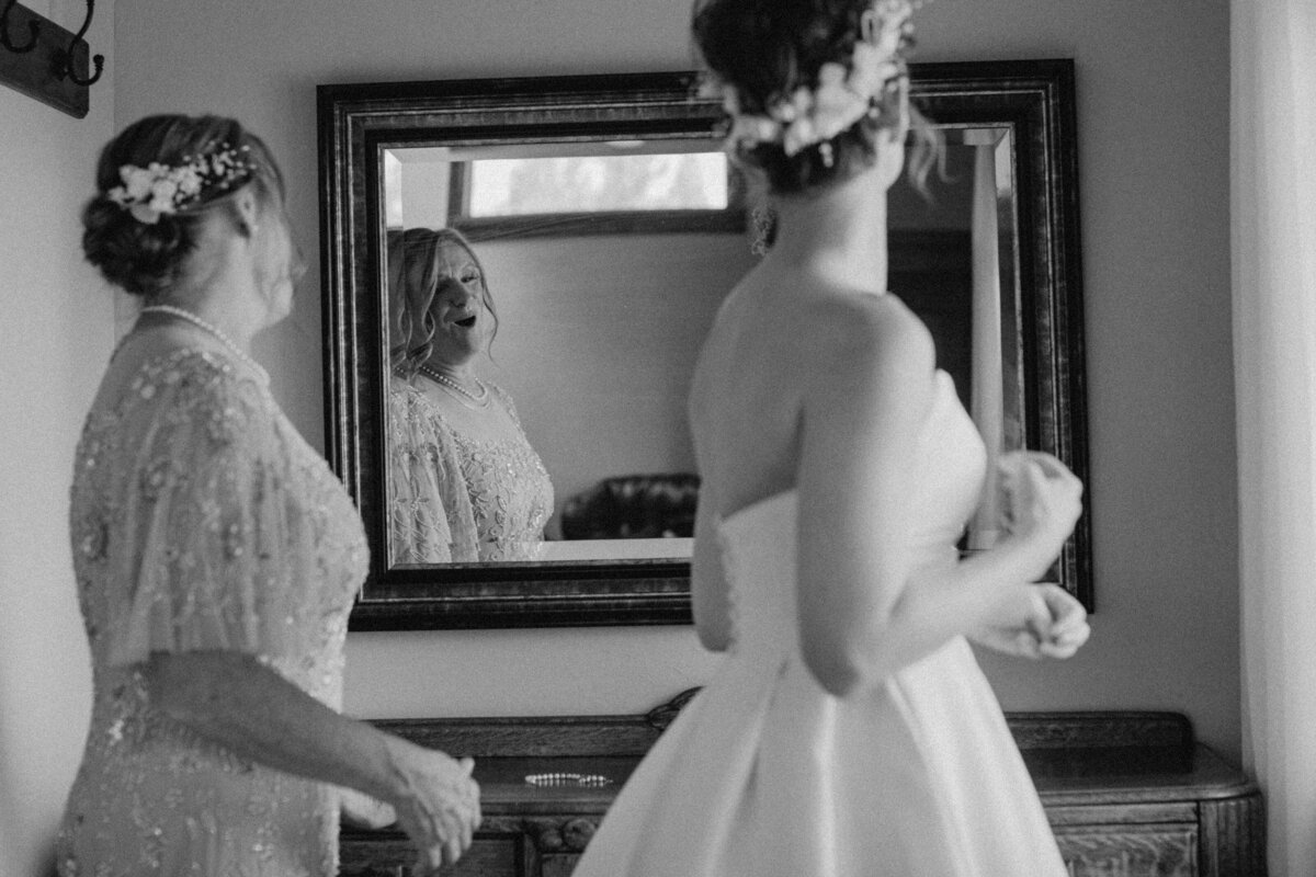 mom looking at bride