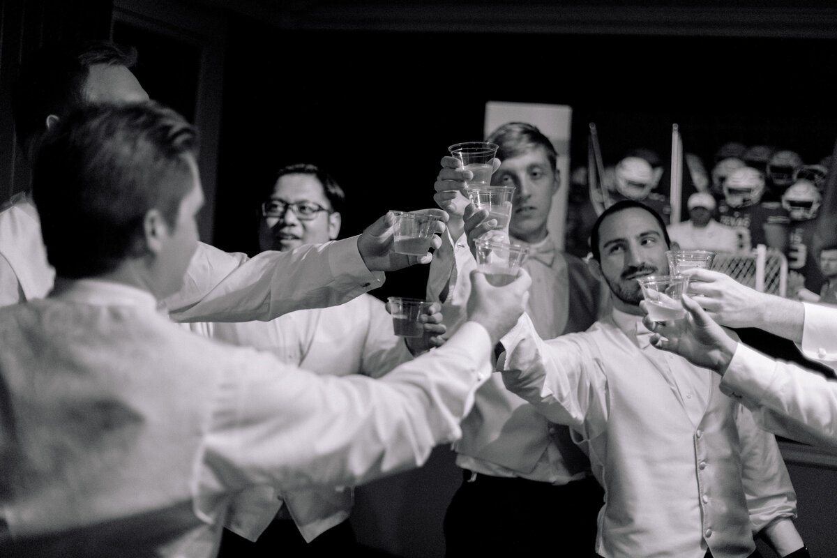 Our groom and his groomsmen celebrate in our Groom's Lounge as they cheers to a new chapter.