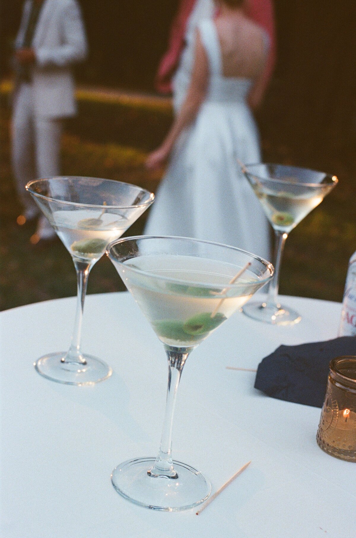 Martini glasses left on table during cocktail hour at a wedding in Upstate New York. 