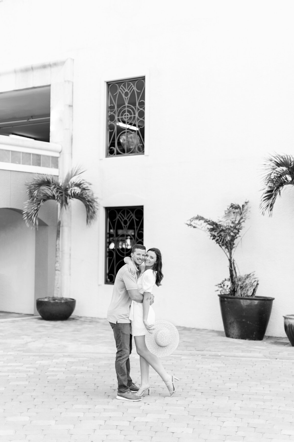 couple hugging and smiling at the camera by wedding photographers naples fl