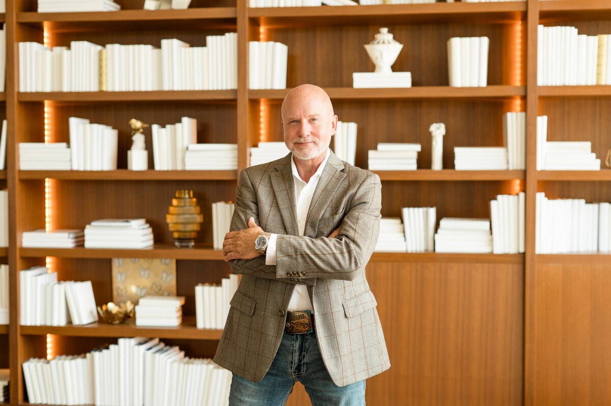 Man in library-style office captured by Houston editorial photographer