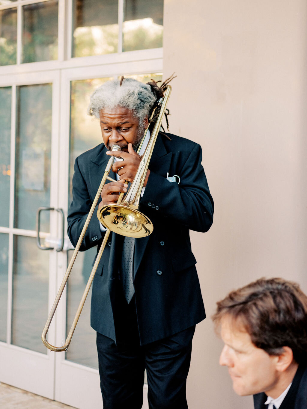 A jazz musician plays live music at a wedding reception, setting the perfect atmosphere for an elegant and memorable celebration.