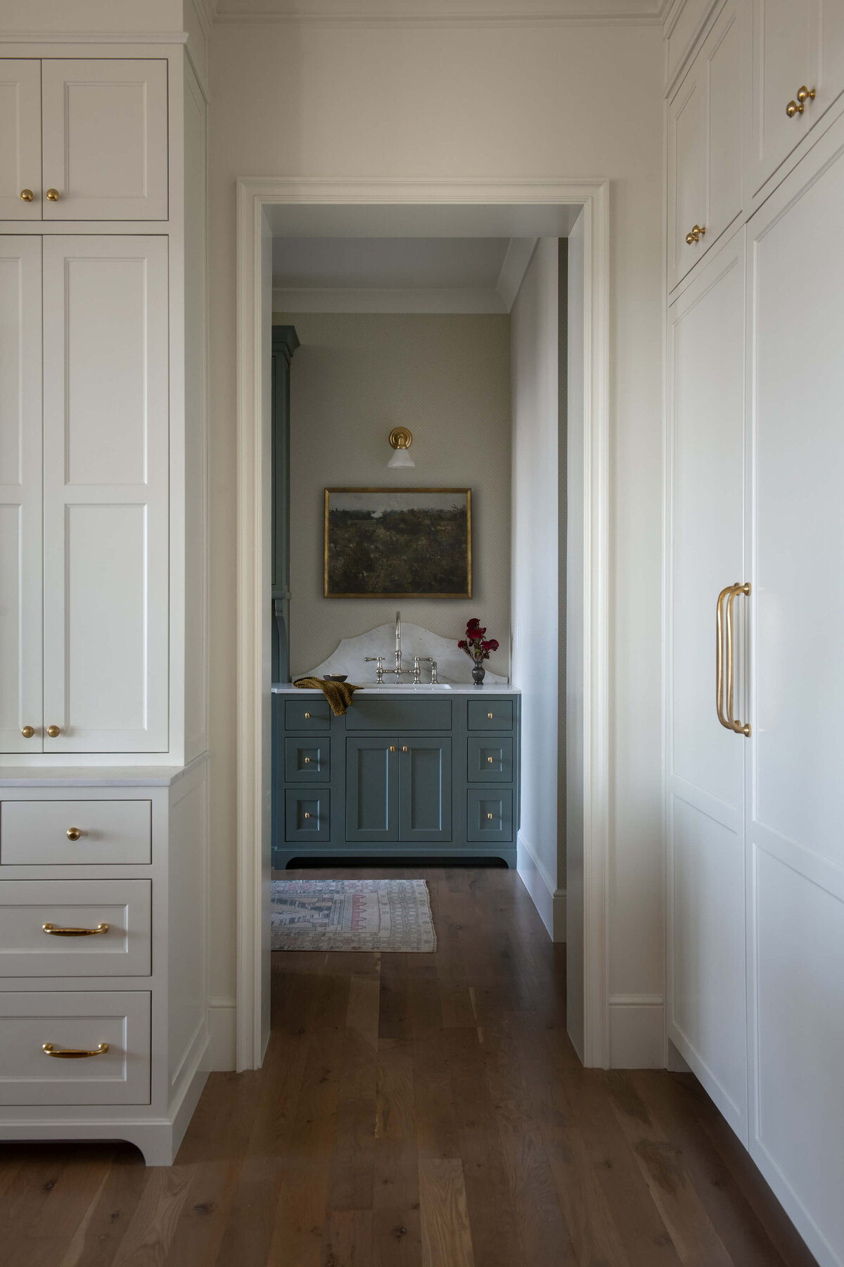 dutch-tudor-bar-with-green-cabinets-and-vintage-art