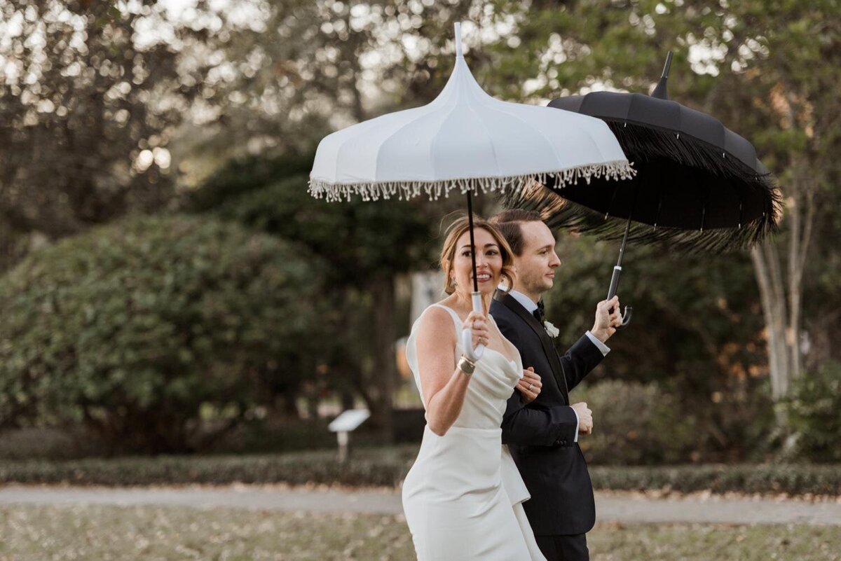 Bride-and-Groom-Second-Line-umbrellas-City-Park-sculpture-garden-wedding-New-Orleans.jpg