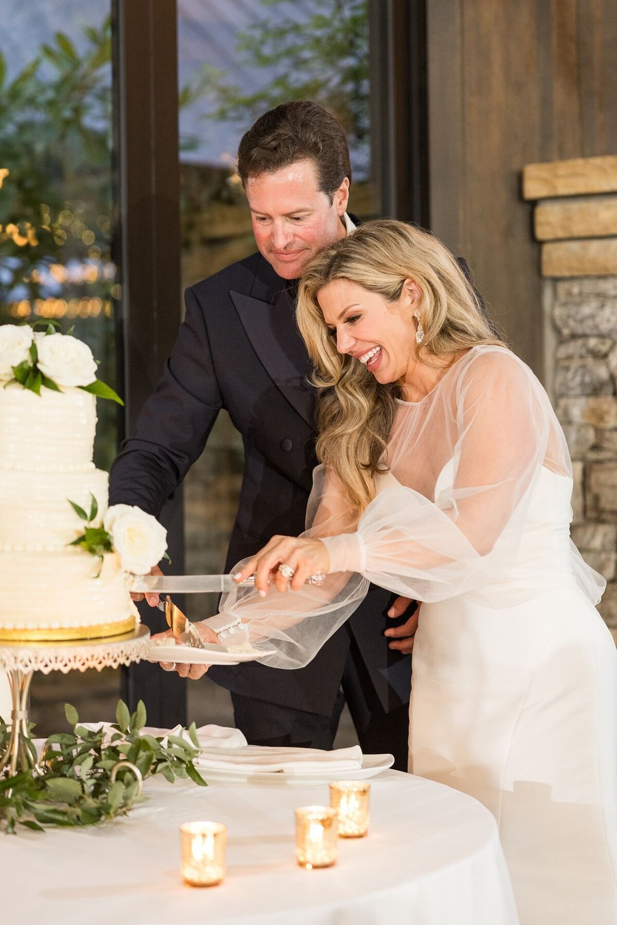 Bride and groom cut their wedding cake