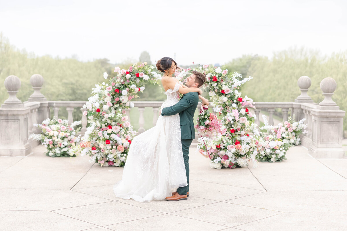bright light and airy wedding photo of bride and groom rings and invitation