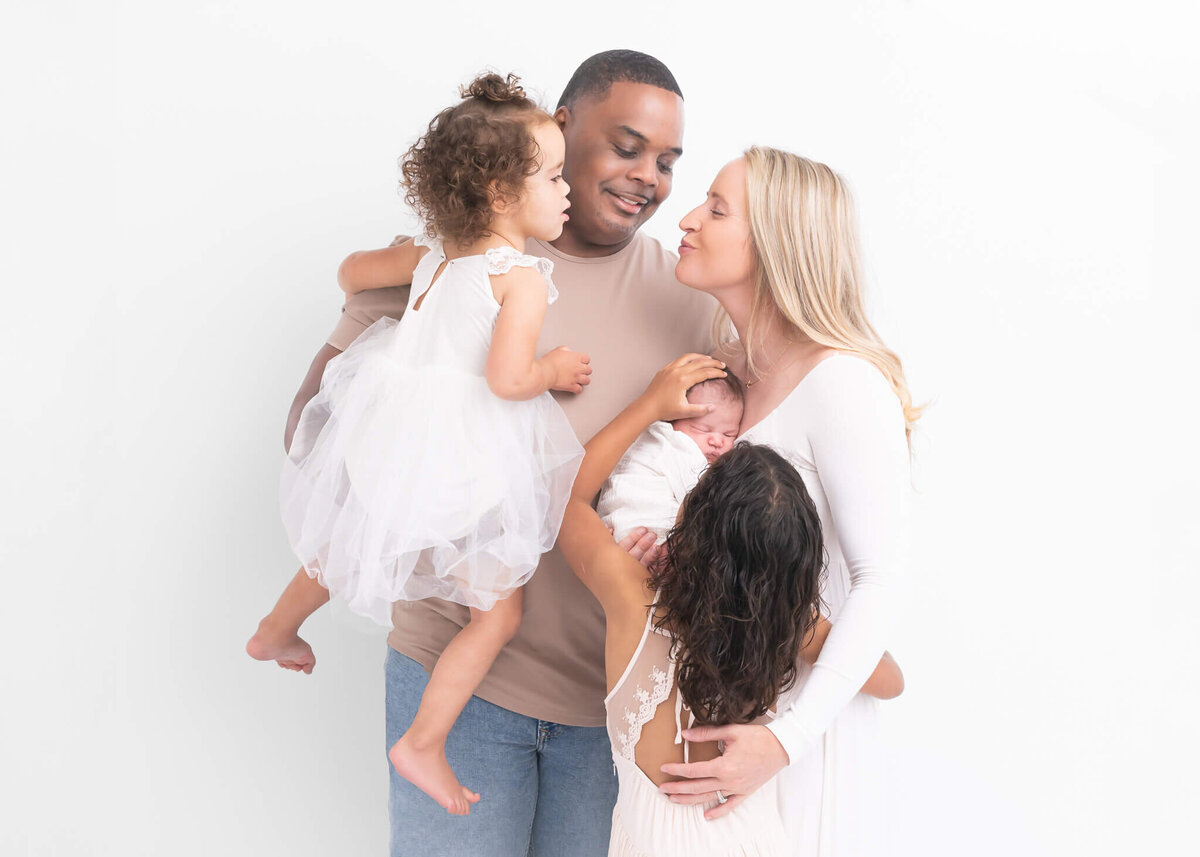 Adorable family of 5 in loving embrace
