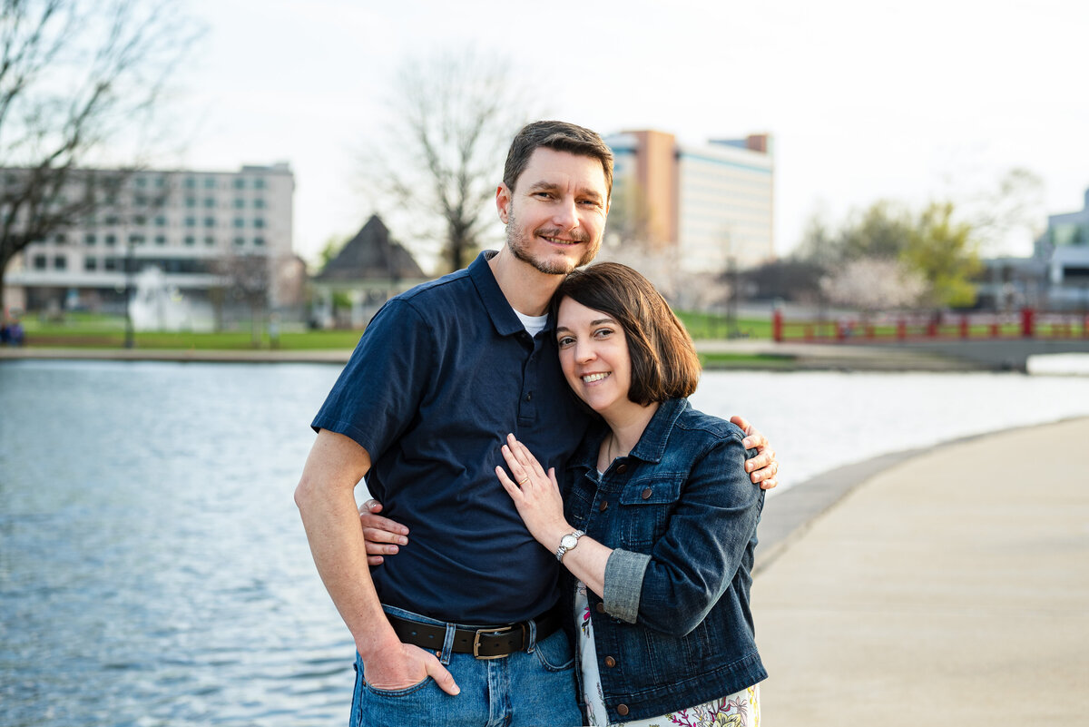 Husband and wife hugs for photos at Big Spring Park in downtown Huntsville
