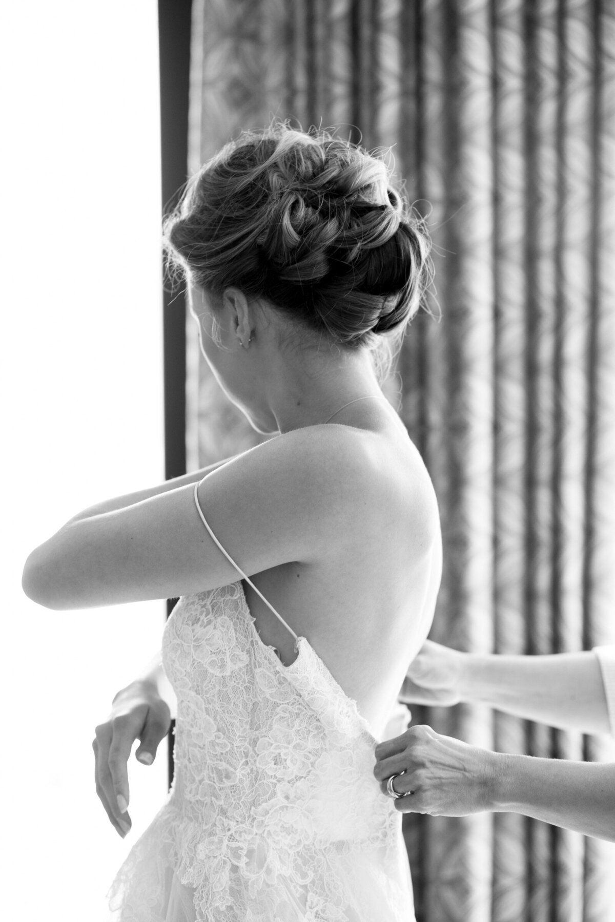 luxury bride getting into dress at ponzi winery