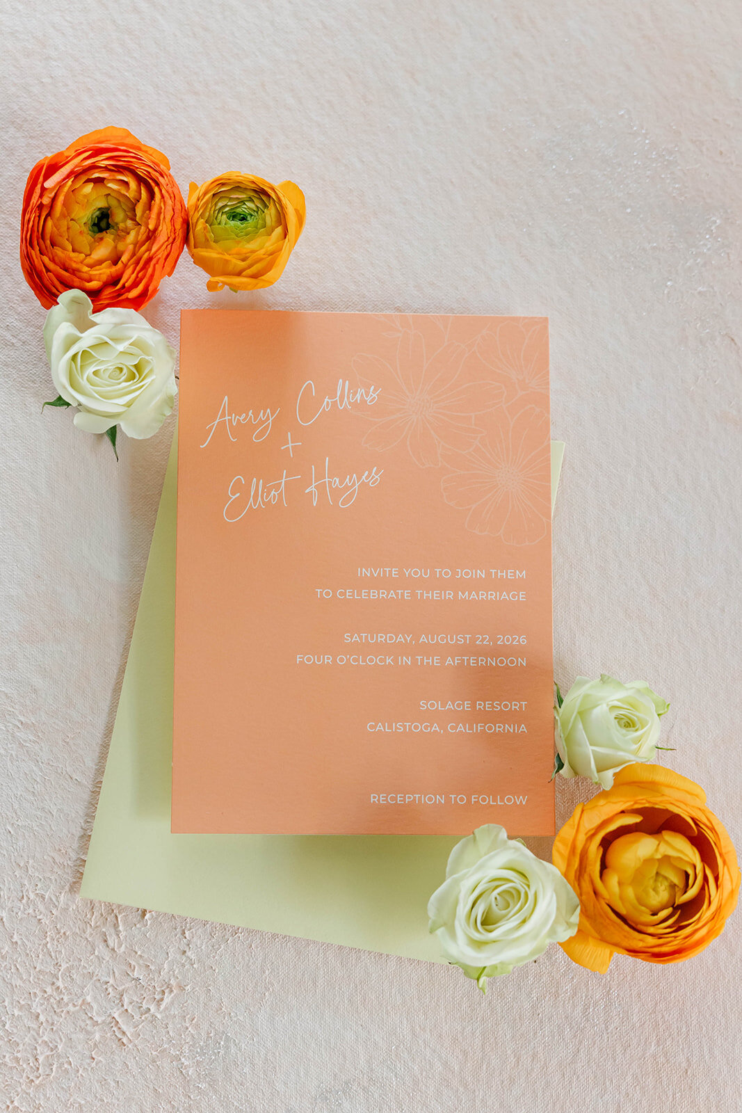 bright-orange-invitation-card-citrus-wedding-flatlay