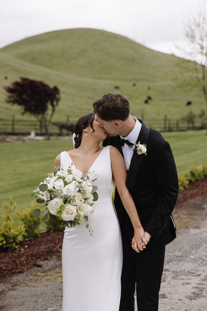 Tri valley, vineyards, grass, white wedding dress, black tux, white flowers, bouquet, round bouquet, white tea roses