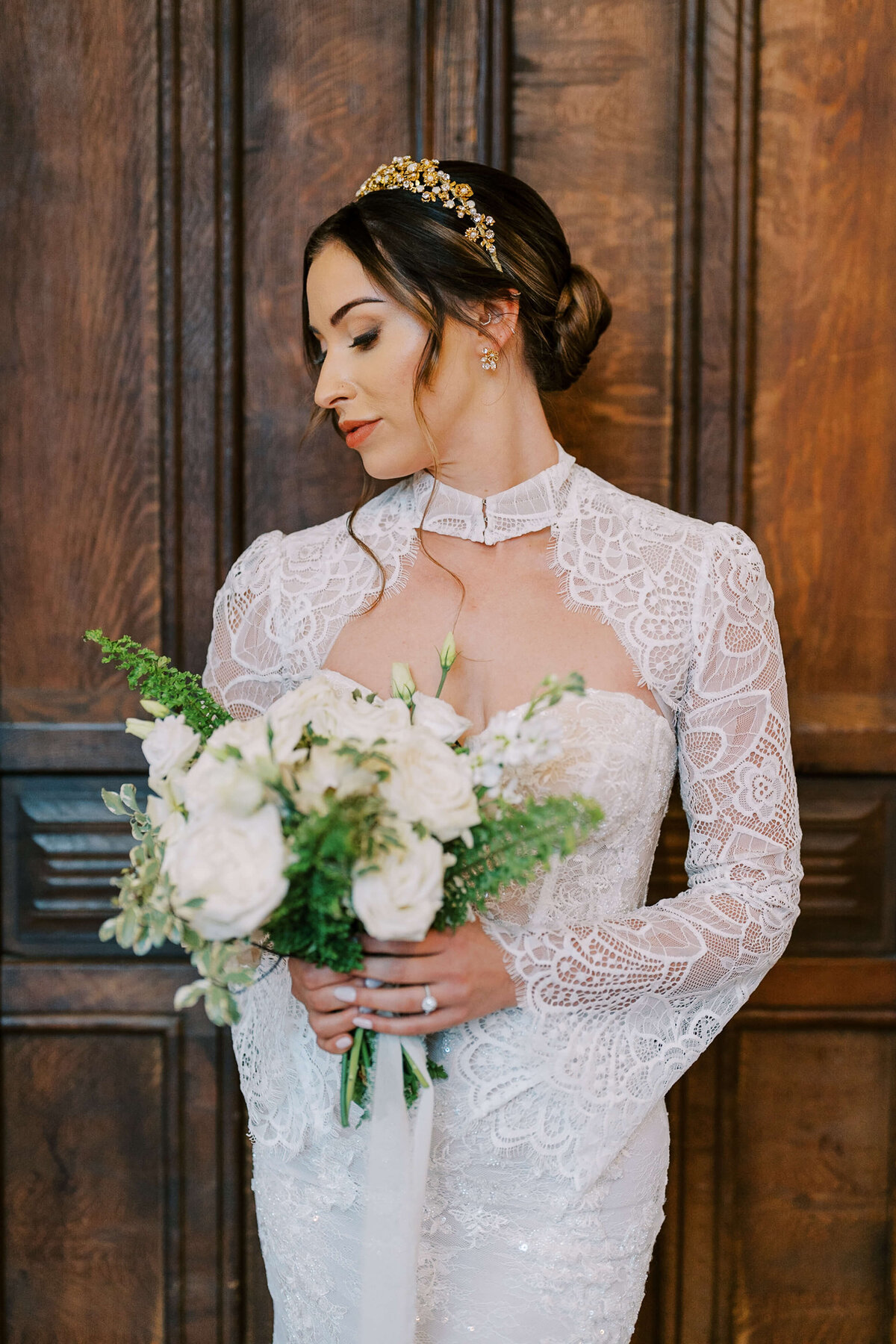 Bride holding white flower bouquet