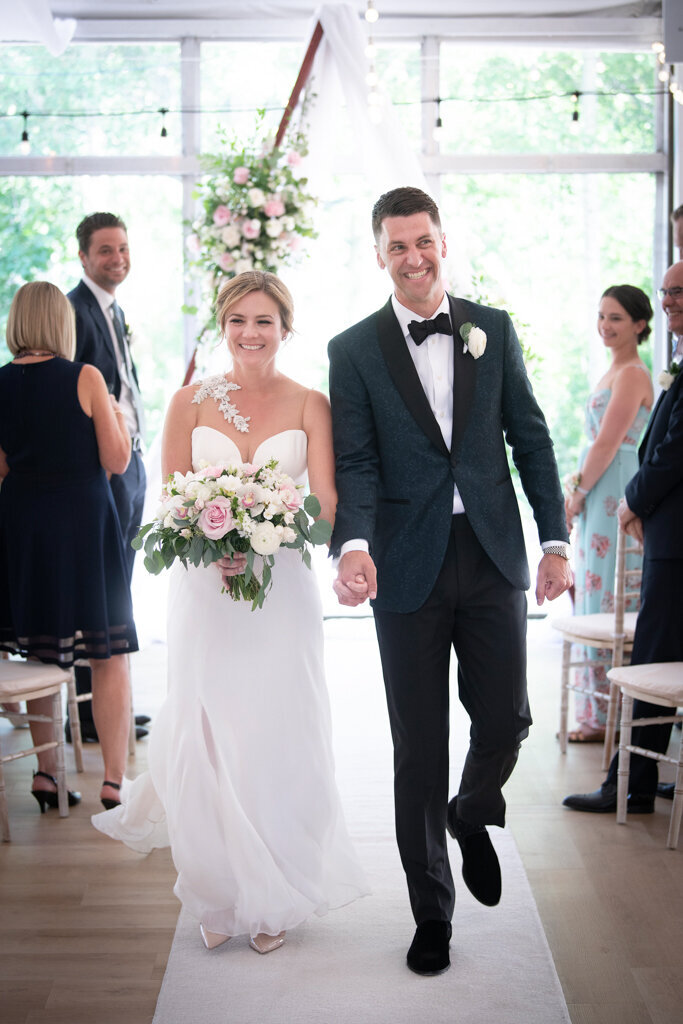 Bride and groom exit ceremony designed by More Events Co, featured on the Brontë Bride Vendor Guide.