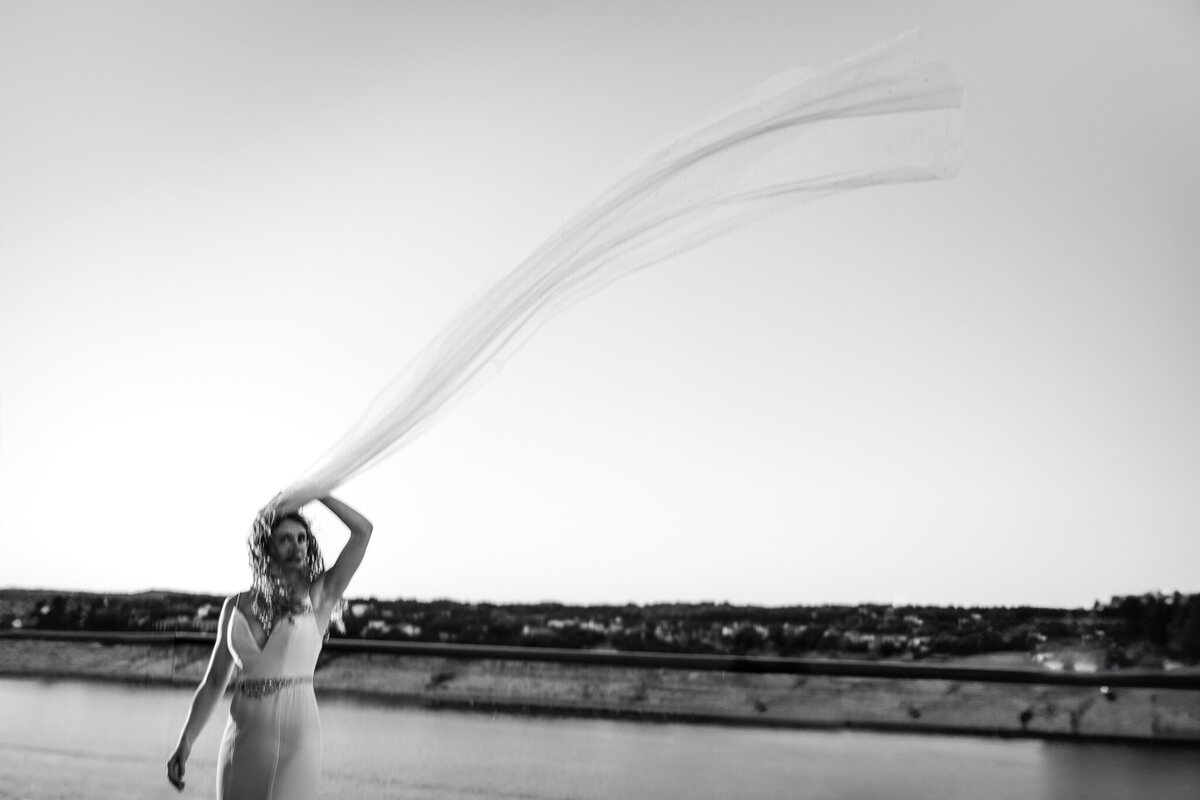 bridal-veil-caught-in-the-wind-at-lakeway-resort-and-spa-wedding-5