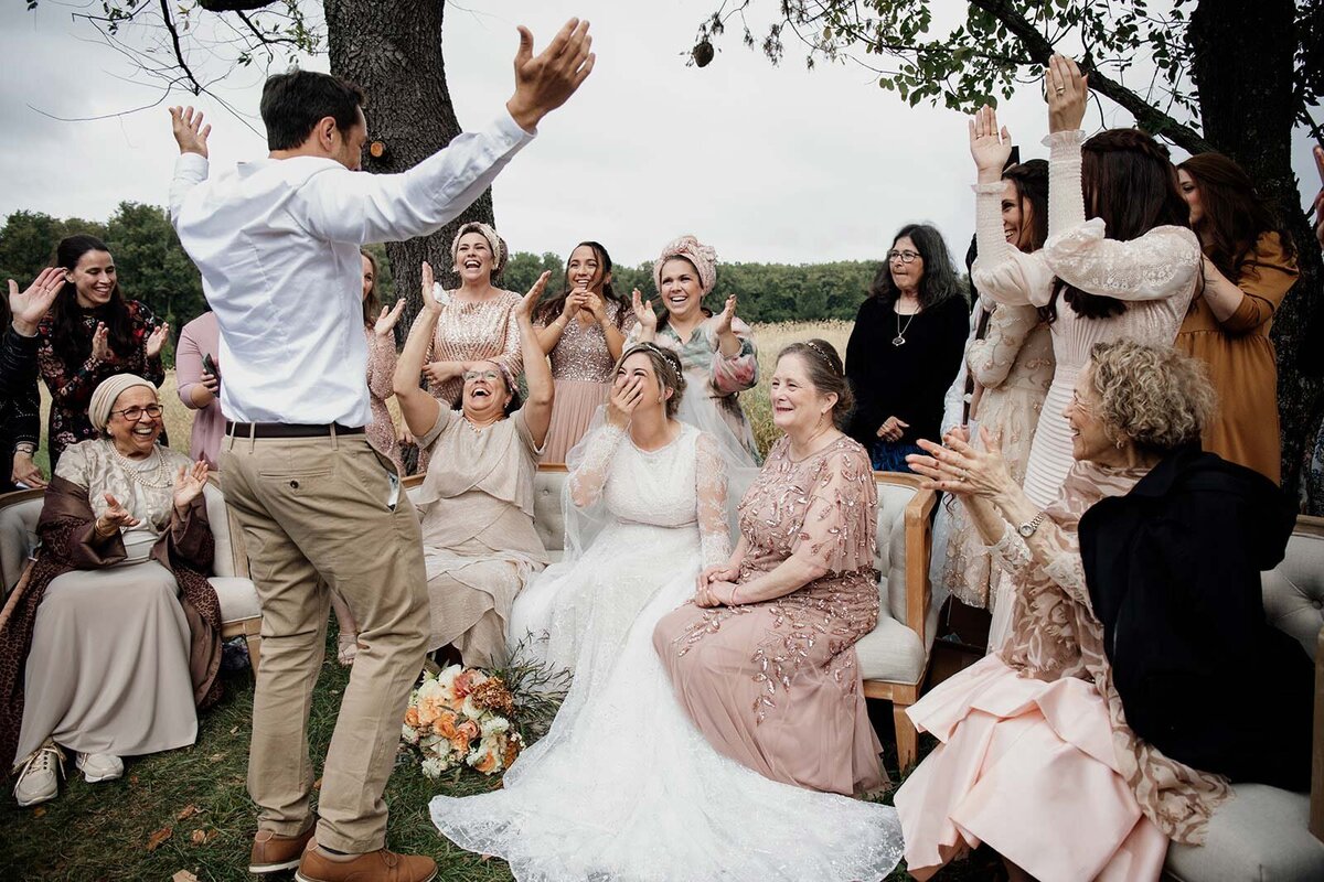 A groom sees the bride for the first time in a week during the Badeken at their ceremony.