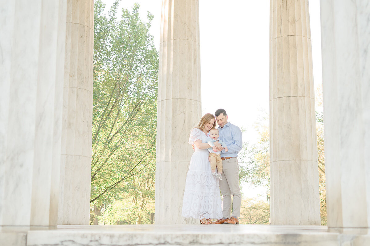 parents looking at baby lovingly during family photography in Chantilly, Virginia