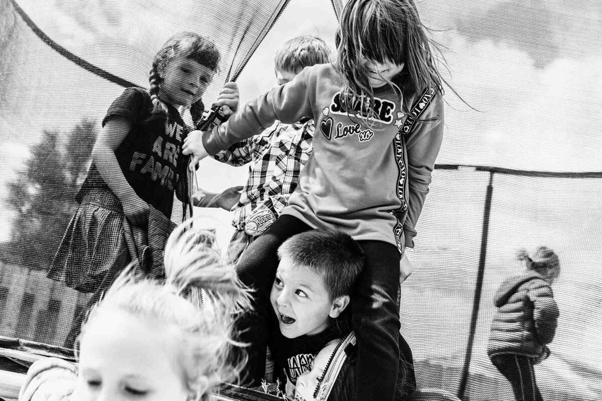 Kids rushing to get out of trampoline at birthday party