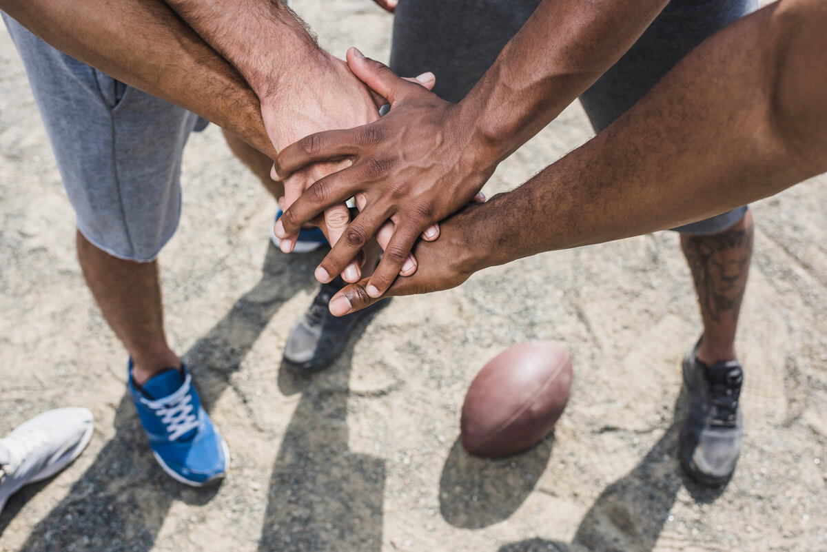 group-of-young-multicultural-men-holding-hands-bef-2024-11-18-16-00-52-utc
