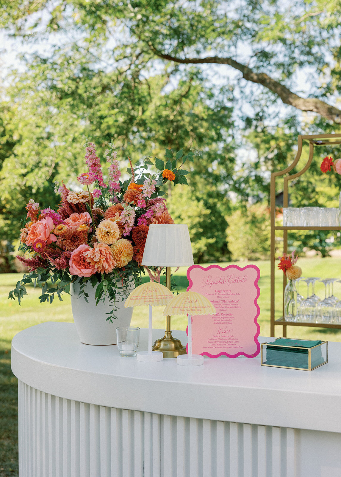 Scalloped Wedding Bar Sign with Colorful Flowers and Lamp at New York Wedding - Verve Event Co. - Laura Rose Pho