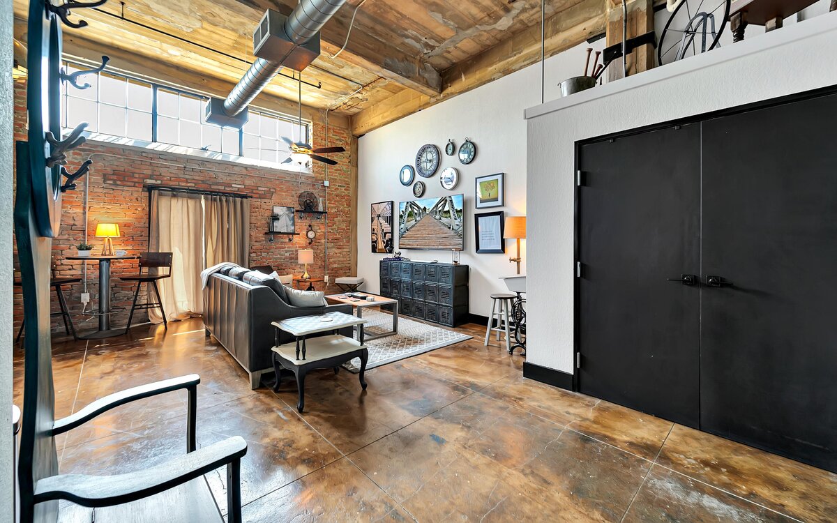 Living area with Smart TV at this two-bedroom, two-bathroom vacation rental condo in the historic Behrens building in the heart of the Magnolia Silo District in downtown Waco, TX.