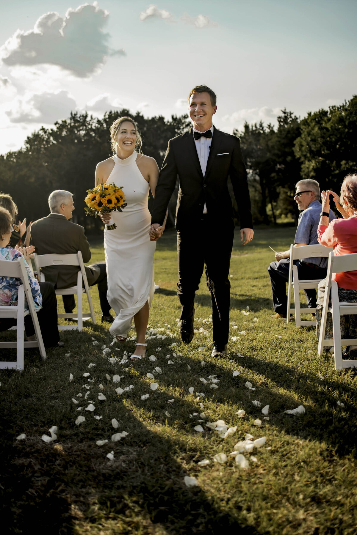 a bride and groom are smiling at backyard wedding in Lorena texas