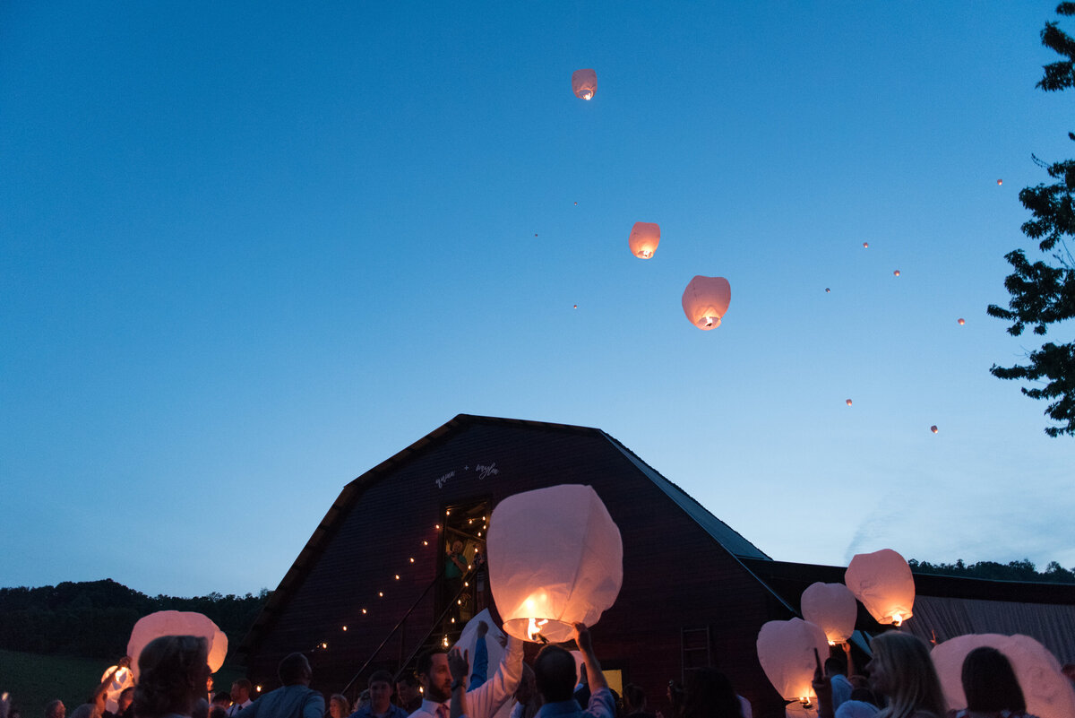 image of wedding guests releasing paper lanterns