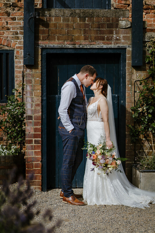 bride groom kissing