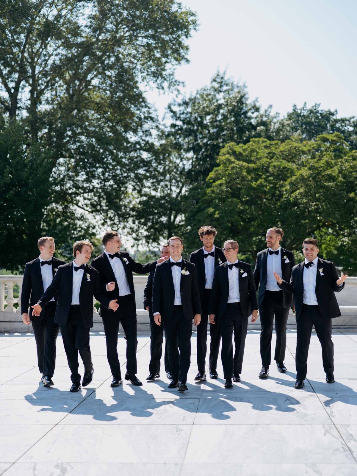 Groom with groomsmen walking at Cleveland Art Museum