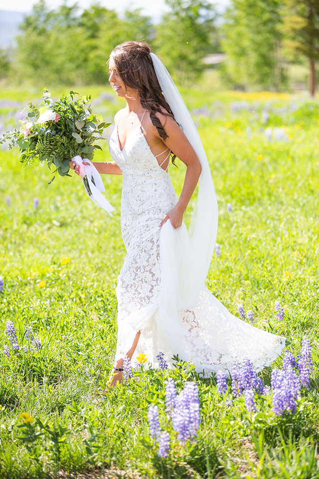 Strawberry-Creek-Ranch-Wedding-Ashley-McKenzie-Photography-Summer-love-on-the-ranch-Bride-Walking-Through-Floral-Fields