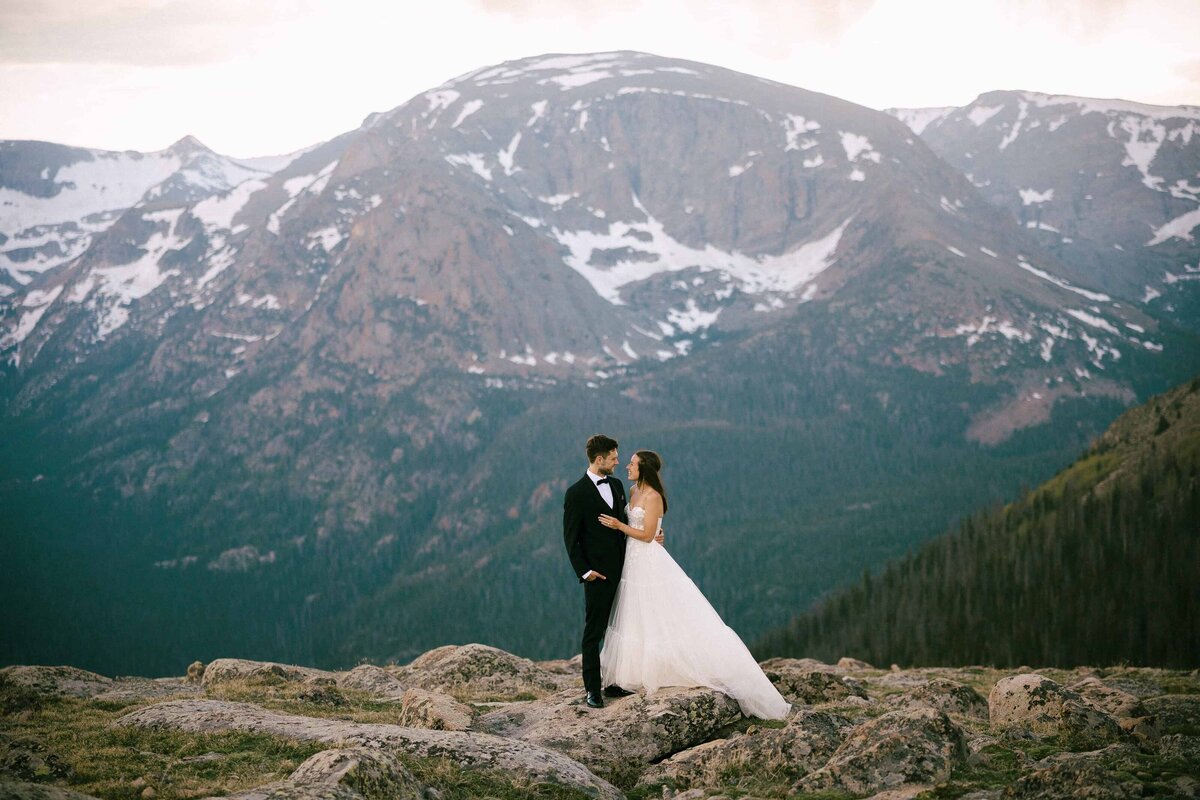 A bride and groom embrace each other in Rocky Mountain National Park during their Colorado elopement. 