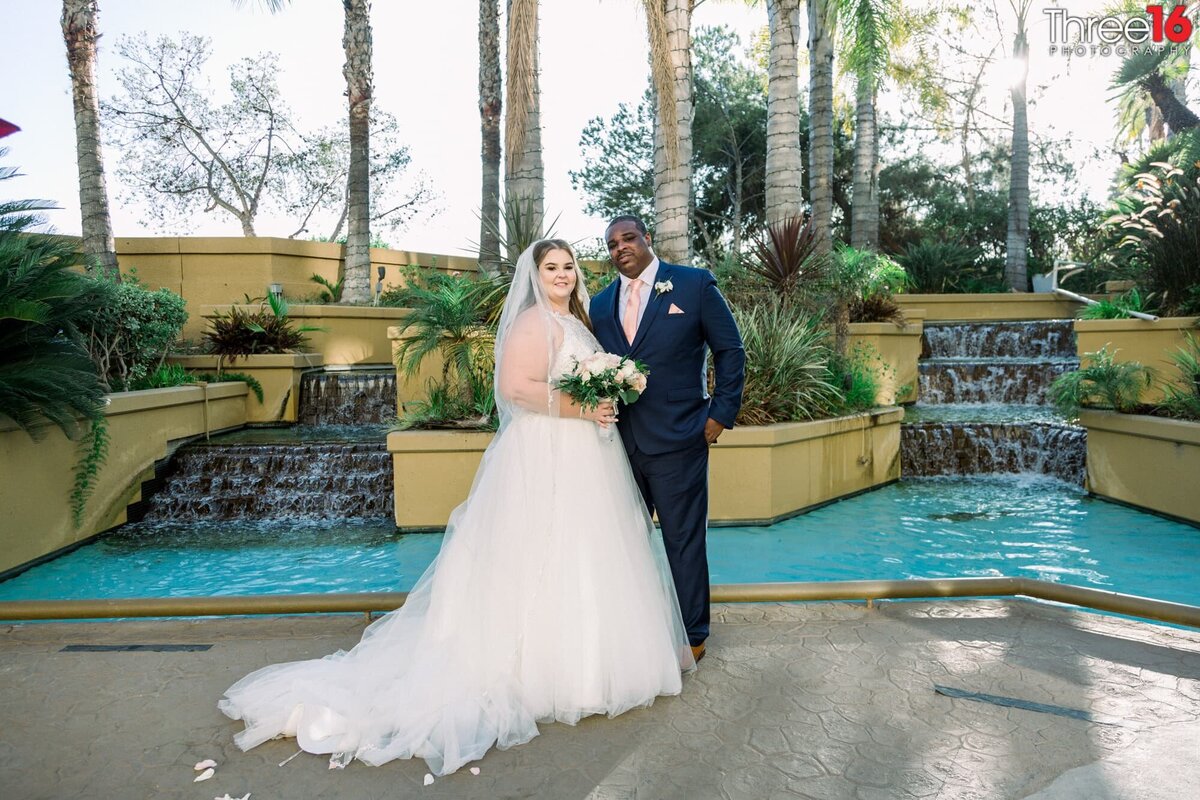 Bride and Groom pose at the beautiful Long Beach Marriott Hotel
